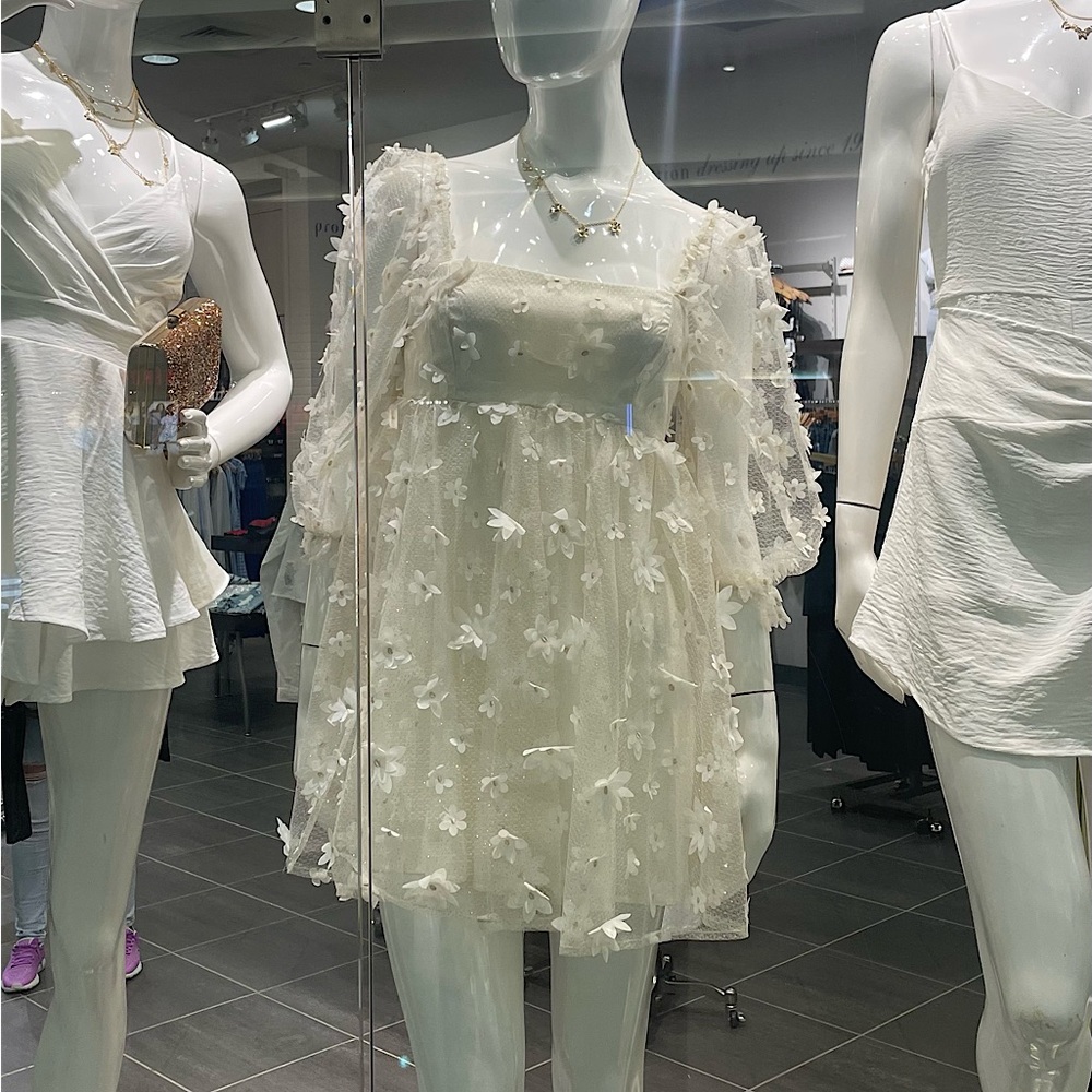 An Ivory Floral Shimmer Mid Dress with Sequin Flowers